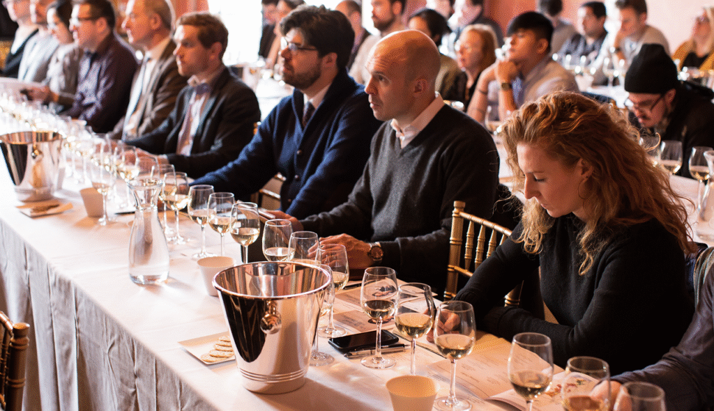 Group photo of room filled with people from the viewpoint of the speaker